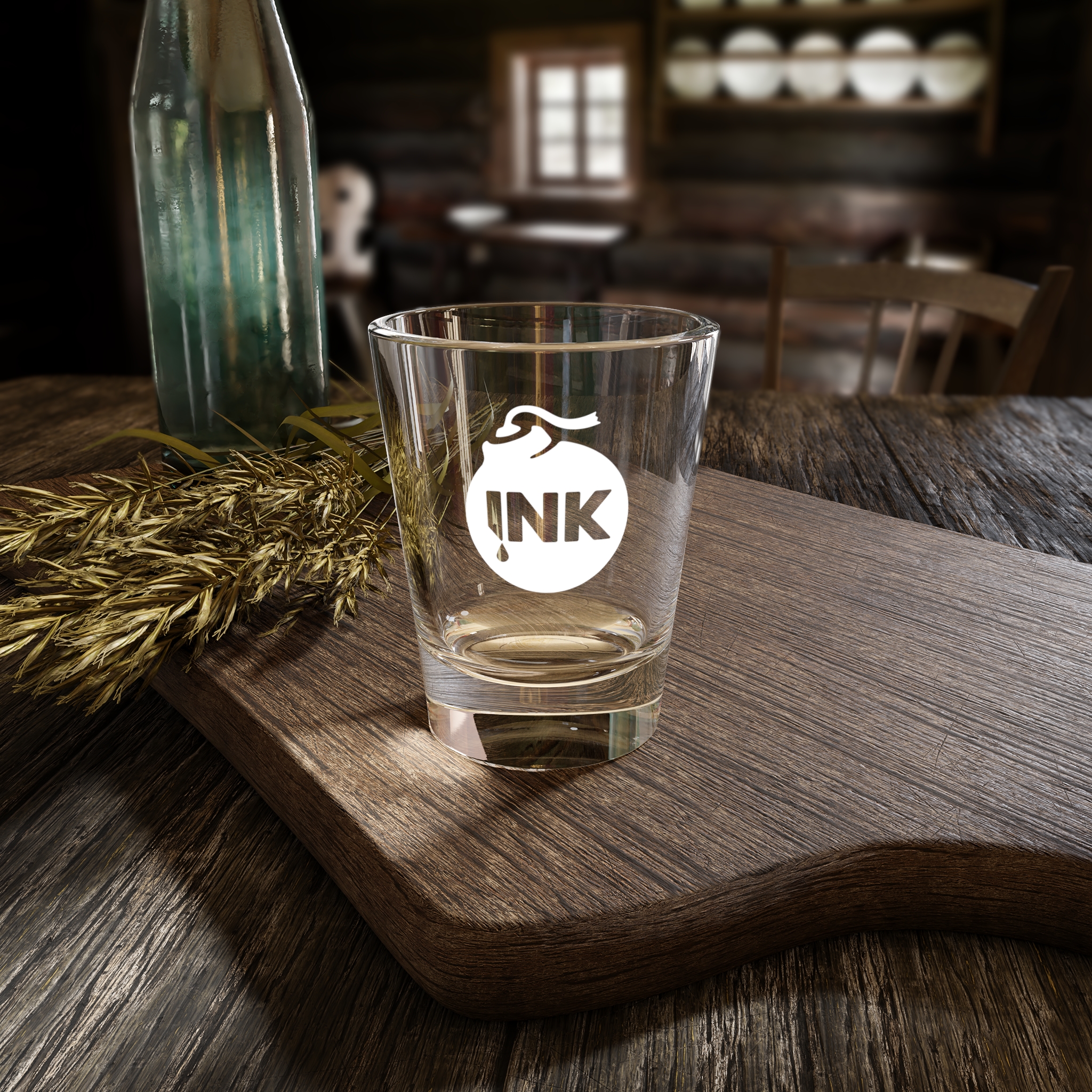 Product photography of the InkBomb 1.5oz Shot Glass on a wooden cutting board on a table